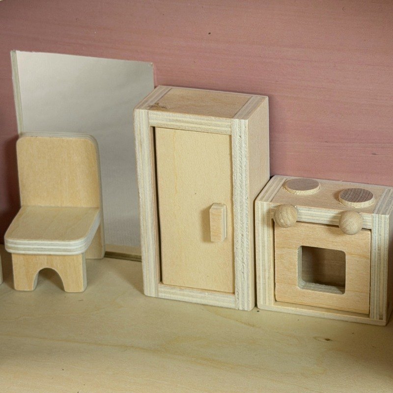 Wooden dollhouse kitchen furniture close-up