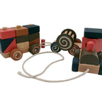 Wooden toy cars with colorful blocks on a white background