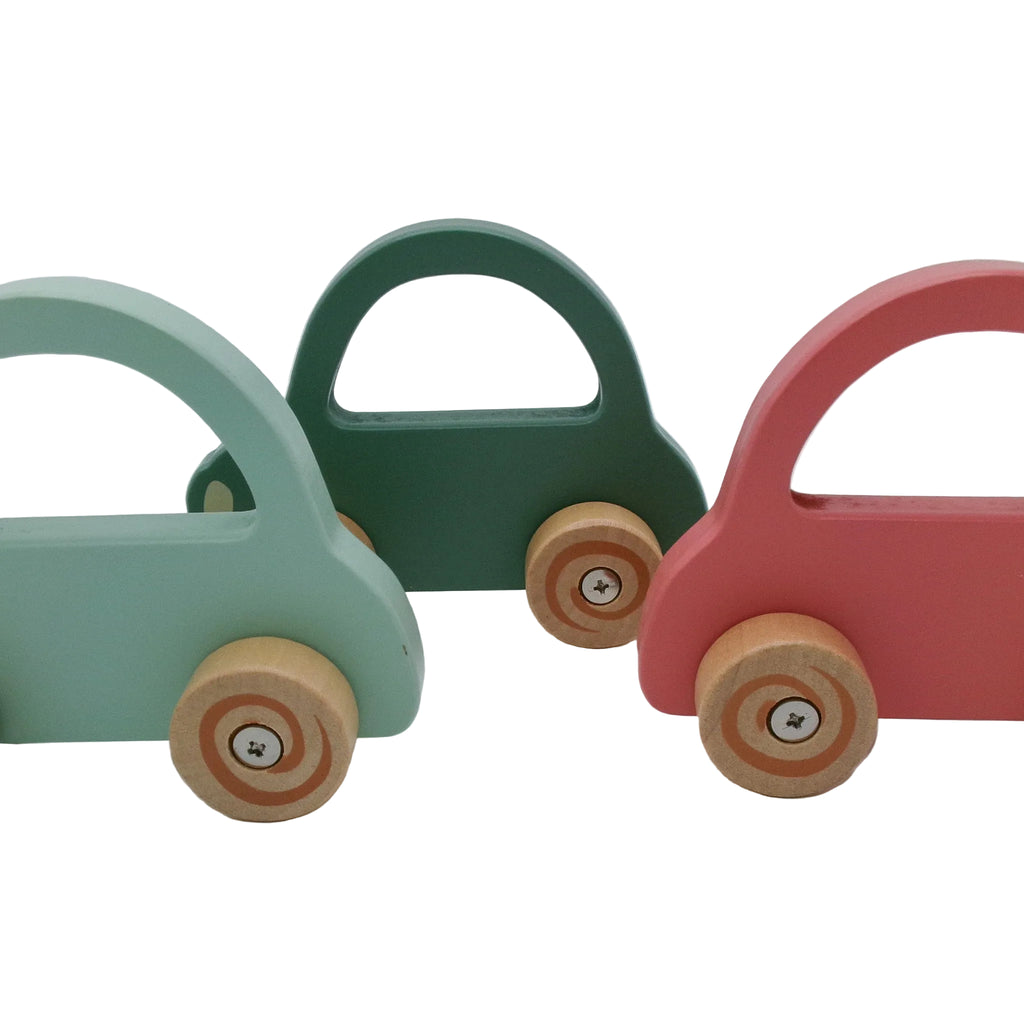 Three colorful wooden toy cars on a white background