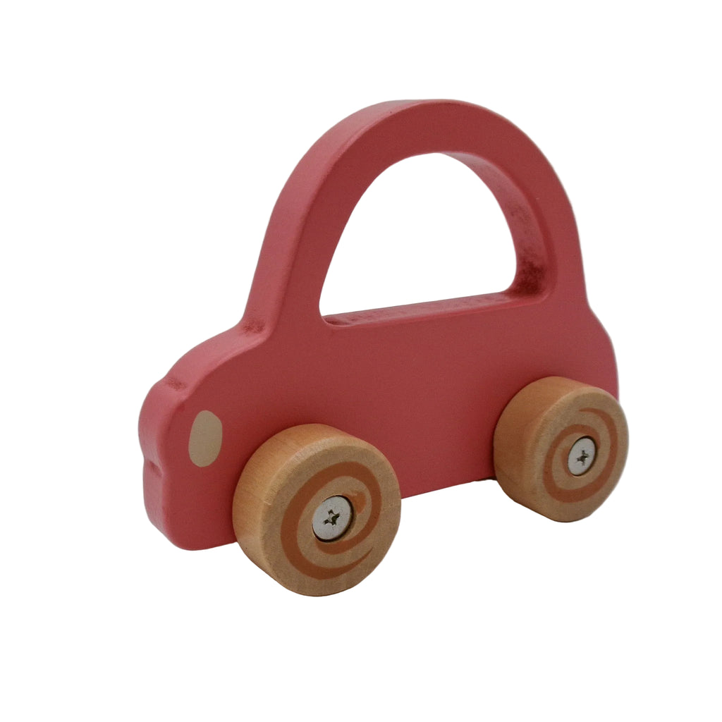 Red toy car with wooden wheels on a white background
