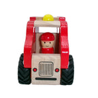 Wooden toy truck with a driver figure on a white background