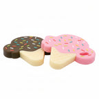 Two ice cream-shaped erasers, one pink with sprinkles and one brown with a scoop, on a white background.