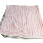 Pink textured fabric on a light gray background