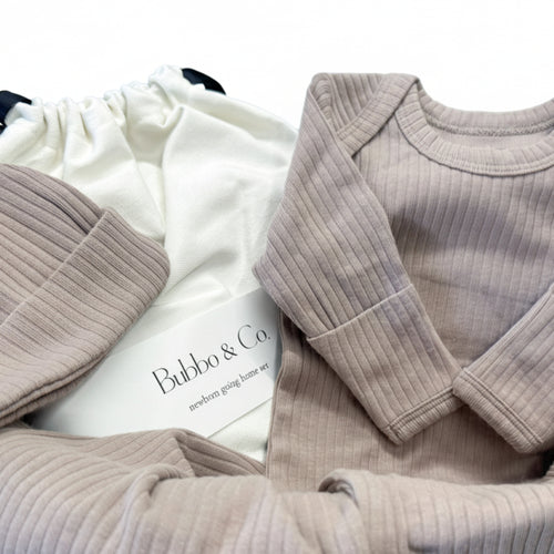 Folded ribbed clothing with a visible brand label on a light background