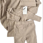 Beige ribbed baby outfit with matching hat and pants on a white background, featuring the brand 'Bubba & Co'.