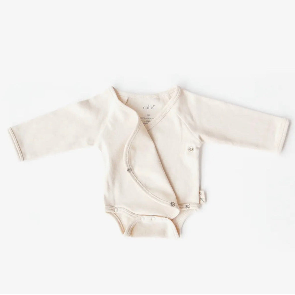 Baby romper with long sleeves on a white background