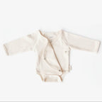 Baby romper with long sleeves on a white background