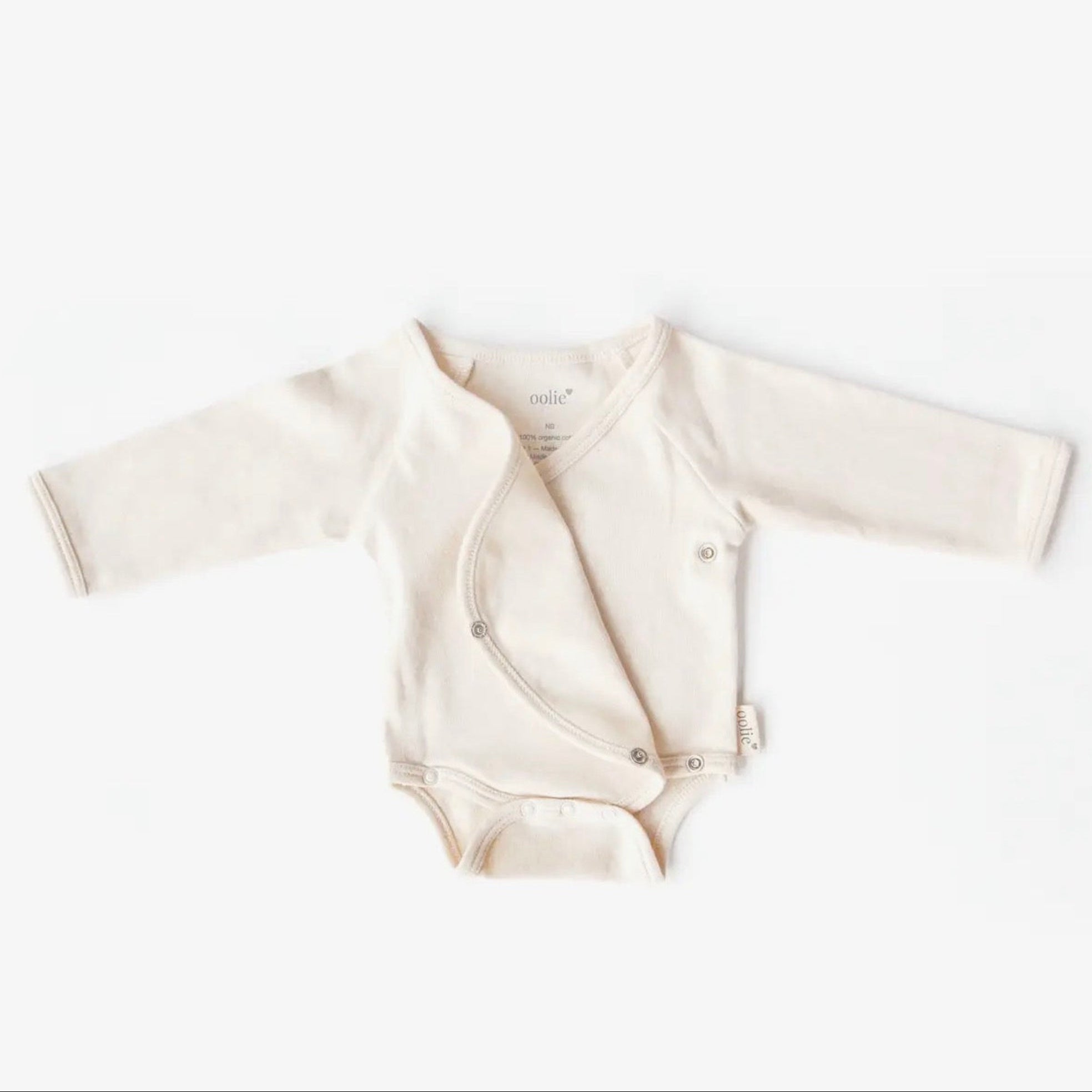 Baby romper with long sleeves on a white background