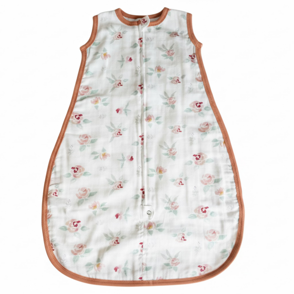 Floral patterned baby sleeping bag on a white background