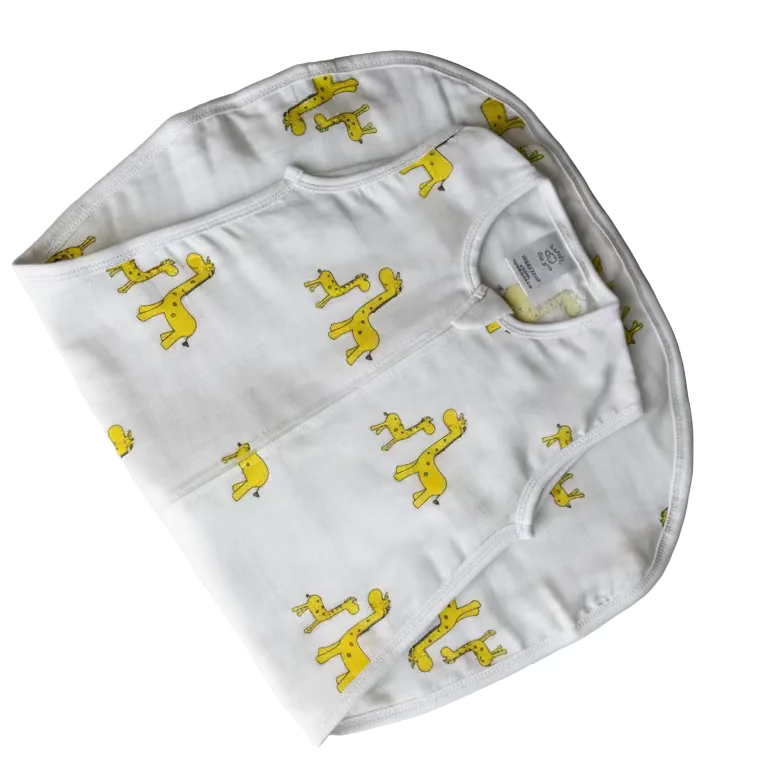 White bib with yellow patterns on a light gray background
