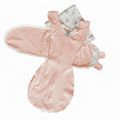 Baby onesie with bear ears and tail on a light-colored surface