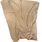 Beige fabric on a wooden surface