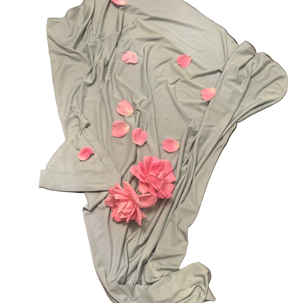 Gray/Green fabric with pink flowers on a wooden surface