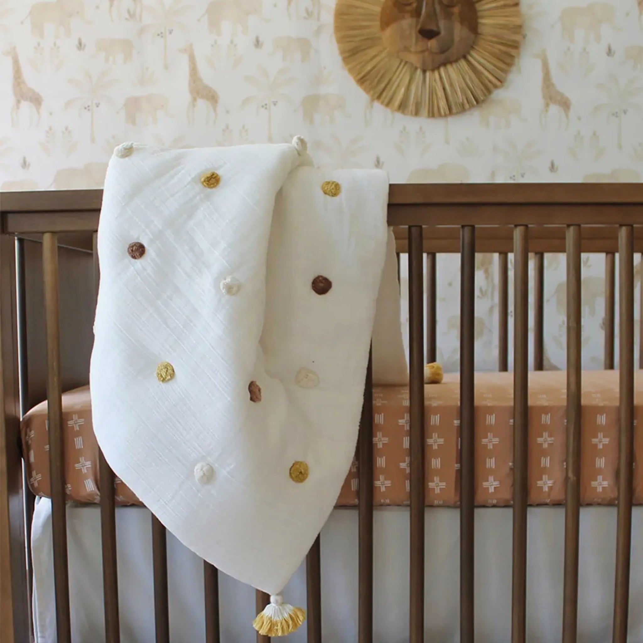 Crib Blanket with Pom Poms - Kendi/Safari Group